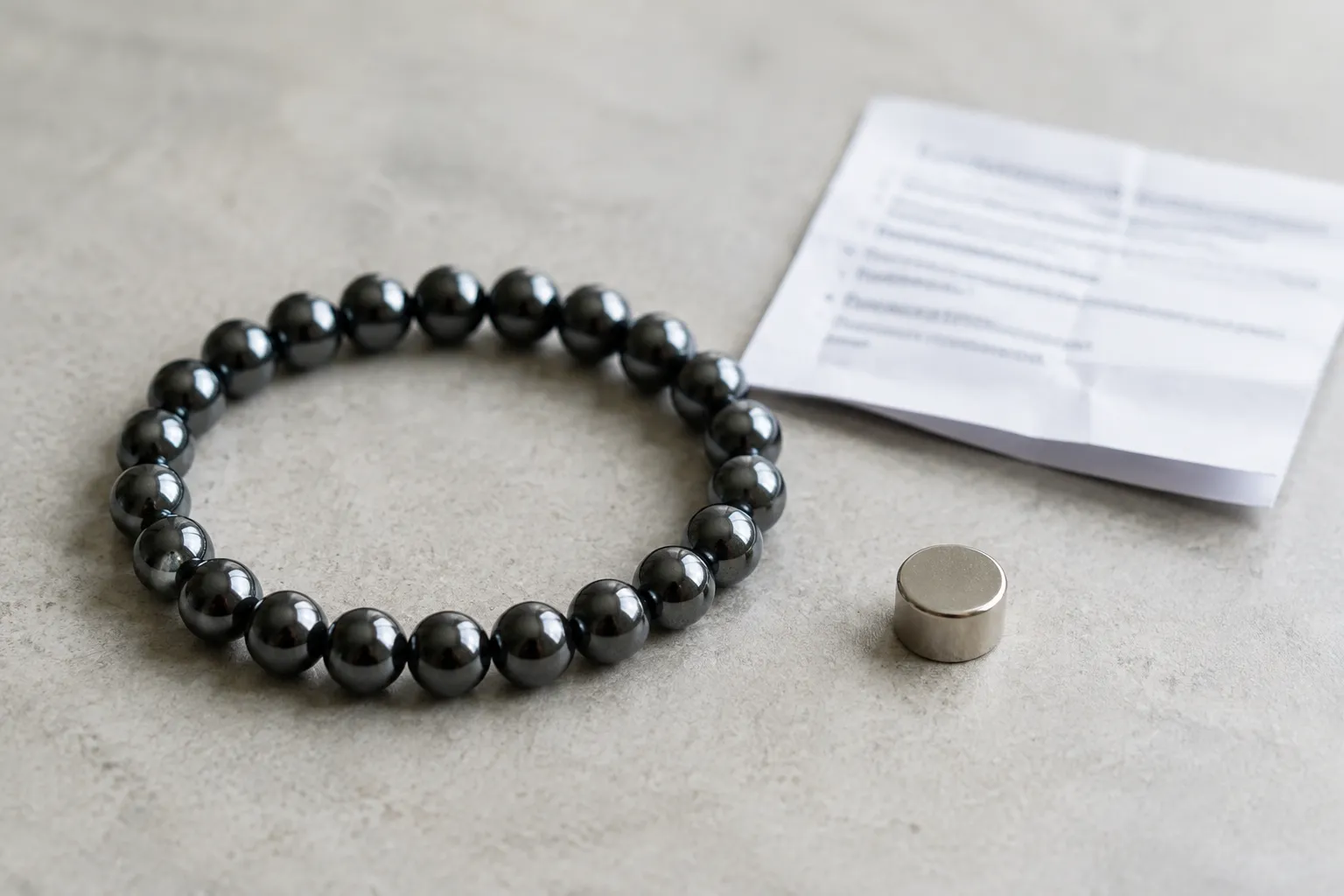 Hematite-style bead bracelet set apart for a magnetic labeling and implanted-device caution check